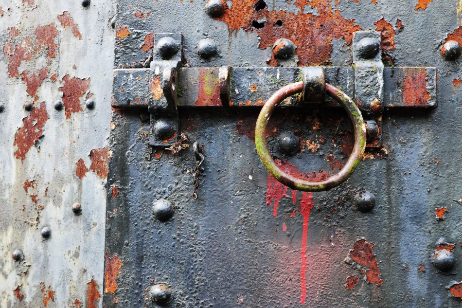 Rusty steel latch on steel bunker tunnel door, Artillery Hill, Fort Worden State Park, Port Townsend, Washington, USA